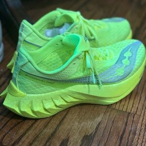 Saucony Green Athletic Shoes with Breathable Mesh and Curved Sole